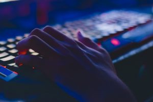 person typing on rgb keyboard