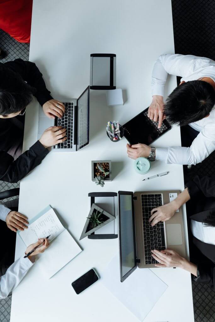 aerial view of people working at desk